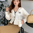 Dazy camisa casual de manga larga con bloques de color, decoracion de lazo e impresion de botones para mujer