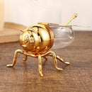 Tarro de Miel con Forma de Abeja Lujoso - Frasco Metálico Dorado y Vidrio con Tapa Articulada y Cuchara, Almacenamiento Decorativo para Miel, Especias, Azúcar, Té - Estilo Vintage para Mesa, 14x9.6x8 cm