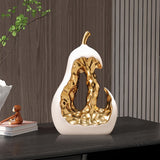 1 pieza de moderna escultura de pera de cerámica abstracta - Elegante adorno decorativo dorado y blanco para el hogar o la oficina, regalo perfecto para las vacaciones, exhibición en la mesa o el armario, decoración de oficina