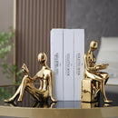 Elegantes sujetalibros abstractos en tono dorado minimalista: Ideal para decorar la oficina en casa o la sala de estar