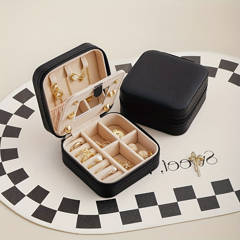 Un elegante y creativo joyero portátil para anillos y pendientes, con una cremallera y una tapa abatible para facilitar su transporte. Este estuche de viaje incluye un espejo y está diseñado para collares, pendientes y anillos, joyeros.