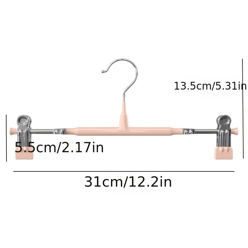 El producto cuenta con una entrada de moldeado por inyección normal en un paquete de 10, incluyendo clips de colgar pantalones retráctiles para uso doméstico, perchas JK sin huella para colección de ropa y clips de acero inoxidable para faldas, que sirve