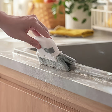 Un cepillo de limpieza portátil versátil adecuado para ventanas y cocinas - Cuenta con surcos y herramientas para grietas fáciles de usar, un elemento esencial reutilizable para limpiar el polvo en casa.