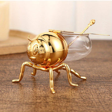 Tarro de Miel con Forma de Abeja Lujoso - Frasco Metálico Dorado y Vidrio con Tapa Articulada y Cuchara, Almacenamiento Decorativo para Miel, Especias, Azúcar, Té - Estilo Vintage para Mesa, 14x9.6x8 cm
