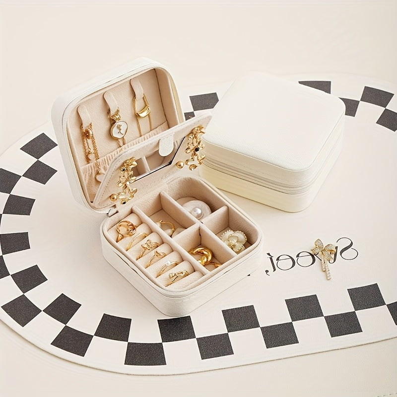 Un elegante y creativo joyero portátil para anillos y pendientes, con una cremallera y una tapa abatible para facilitar su transporte. Este estuche de viaje incluye un espejo y está diseñado para collares, pendientes y anillos, joyeros.