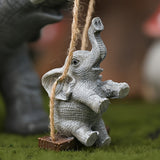 Encantadora Figura de Elefante en Resina con Columpio y Cuna – Diseño Gris Detallado para Decoración Interior/Exterior, Ideal para Sala, Estantería, Vitrina o Soporte de Televisión, Adorno de Elefante