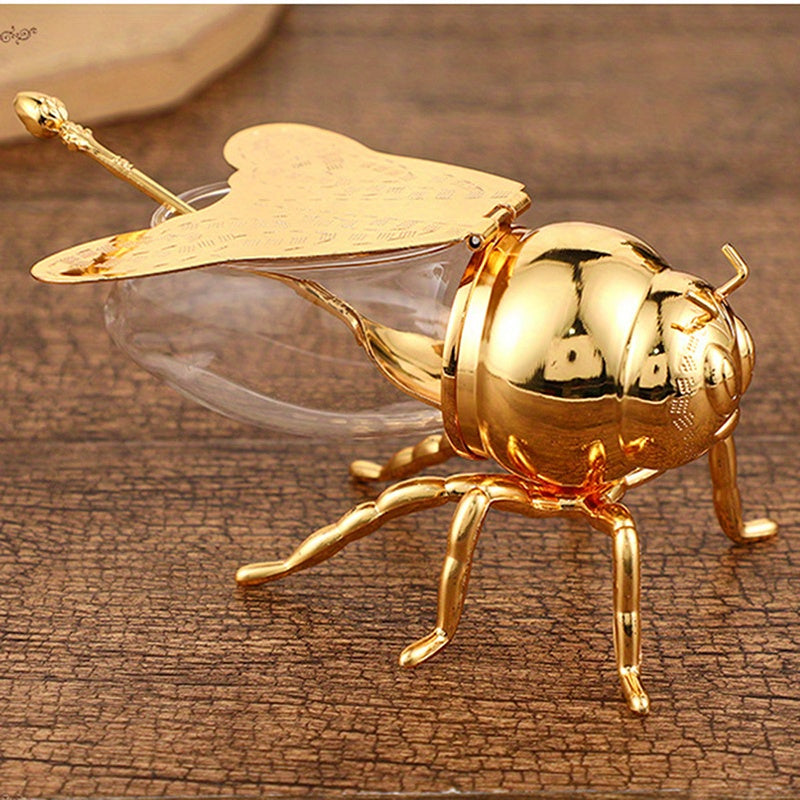 Tarro de Miel con Forma de Abeja Lujoso - Frasco Metálico Dorado y Vidrio con Tapa Articulada y Cuchara, Almacenamiento Decorativo para Miel, Especias, Azúcar, Té - Estilo Vintage para Mesa, 14x9.6x8 cm