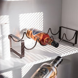 1 estante de vino plegable - Soporte de exhibición de vino de hierro pulido con diseño elegante y curvo, perfecto para decoración de bar en casa o cocina, mantiene varios botellas seguras, decoración de vino