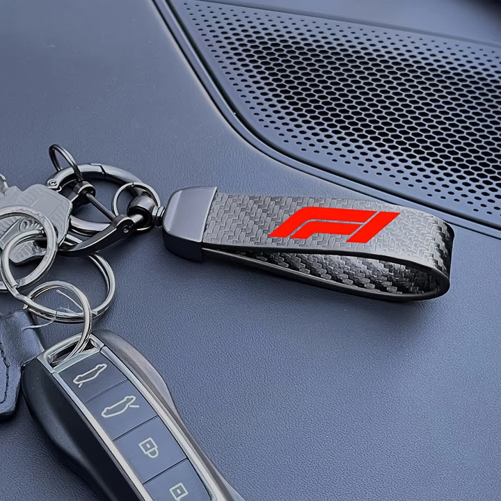 Llavero de fibra de carbono con diseño F1, 1 unidad, estilo negro y rojo de carreras, aleación de zinc resistente y cuero sintético, ideal para entusiastas del deporte y regalos nostálgicos, accesorios de carreras | Llavero elegante | Diseño de fibra de