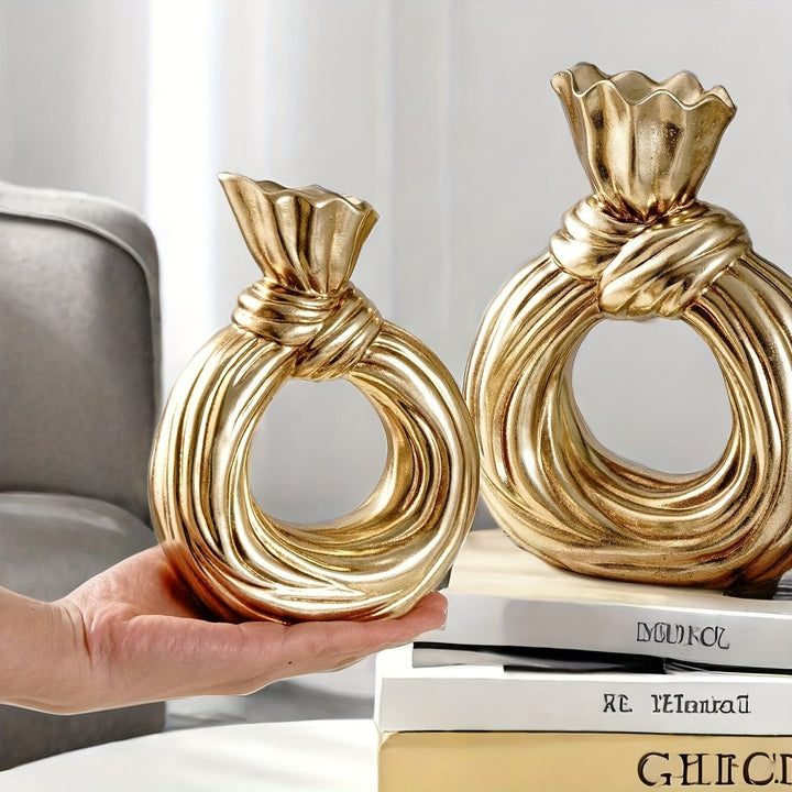 Una botella decorativa de resina, ideal para decoración de hogar contemporáneo, un jarrón minimalista nórdico bohemio para flores de pampa, con un diseño distintivo de lazo, apto para uso como jarrón o como regalo decorativo.