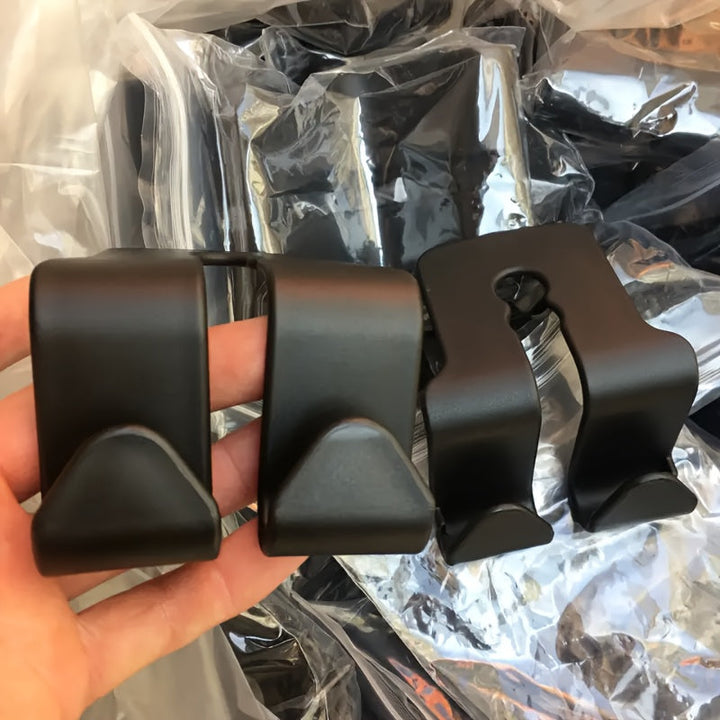 2 piezas de gancho multiusos para respaldo de asiento de coche - Gancho doble para almacenamiento de cinturones de seguridad, cojines de cabeza y accesorios, duradero plástico ABS negro, se adapta a la mayoría de los vehículos, organizador de cinturones