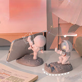 Nuevo soporte para teléfono móvil de astronauta popular, plástico, astronauta de mano, regalo creativo de oficina, soporte de decoración de mesa.