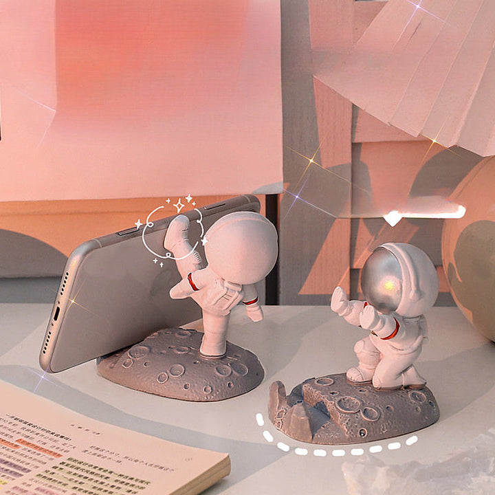 Nuevo soporte para teléfono móvil de astronauta popular, plástico, astronauta de mano, regalo creativo de oficina, soporte de decoración de mesa.
