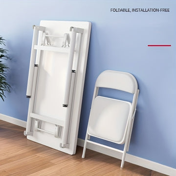 Una mesa plegable rectangular para alquilar, adecuada para comer, estudiar o usar una computadora, sin necesidad de instalación.