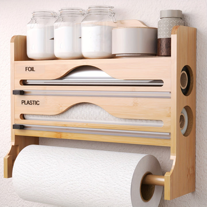 Un cortador de plástico de cocina con soporte para papel toalla, hecho de bambú, sirve como estante de almacenamiento para papel de cocina y papel de aluminio, con dos compartimentos para cortar.