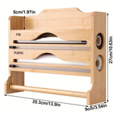 Un cortador de plástico de cocina con soporte para papel toalla, hecho de bambú, sirve como estante de almacenamiento para papel de cocina y papel de aluminio, con dos compartimentos para cortar.