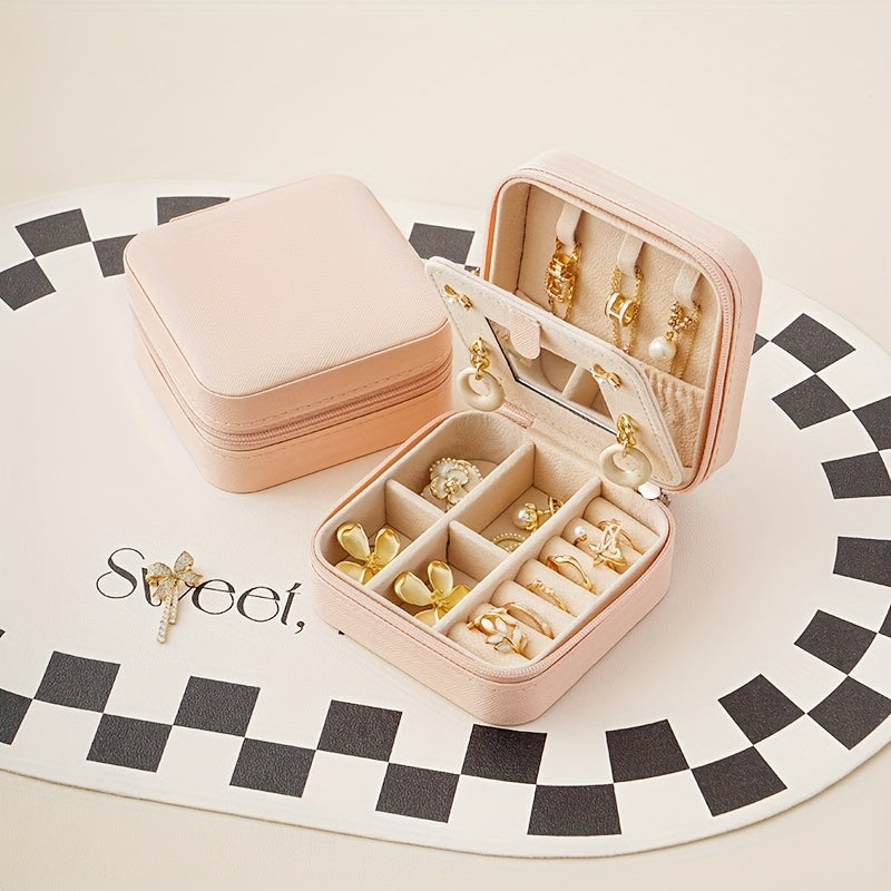 Un elegante y creativo joyero portátil para anillos y pendientes, con una cremallera y una tapa abatible para facilitar su transporte. Este estuche de viaje incluye un espejo y está diseñado para collares, pendientes y anillos, joyeros.