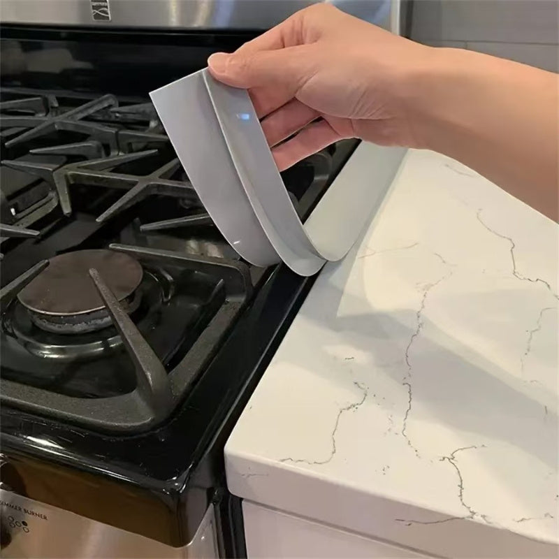 Rejilla de Sellado Integrada para Huecos de Estufa - Cubierta de Borde de Encimera de Alta Calidad para Relleno y Protección contra Salpicaduras, Tira Adhesiva Negra Duradera para Instalación de Estufas, Fácil Montaje en Electrodomésticos de Cocina